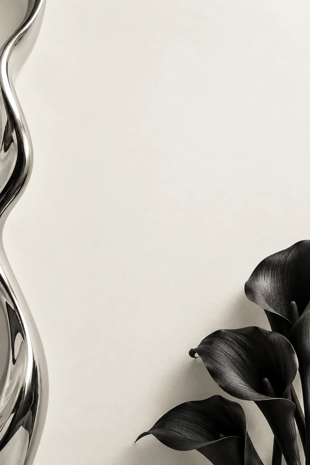 Sculptural black calla lilies and fine monochrome lines around ivory paper